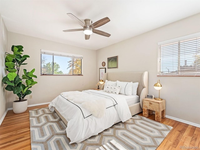 bedroom featuring light hardwood / wood-style flooring and ceiling fan