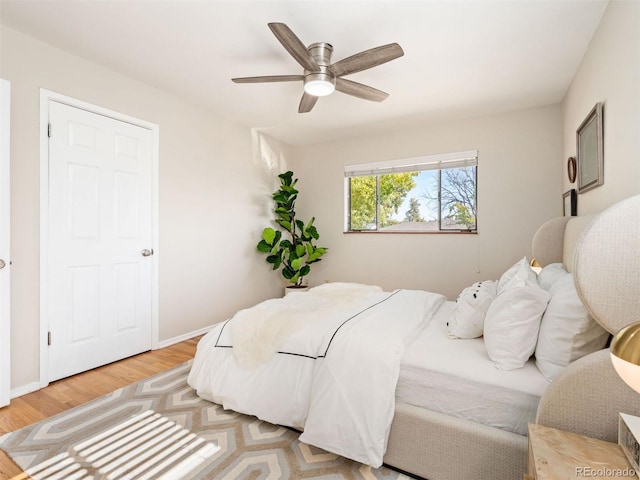 bedroom featuring hardwood / wood-style floors and ceiling fan