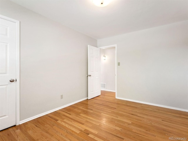 unfurnished room with light hardwood / wood-style floors