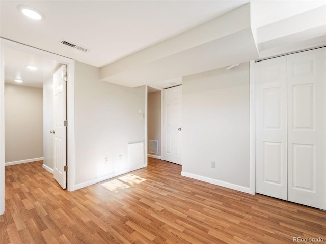 basement featuring light wood-type flooring