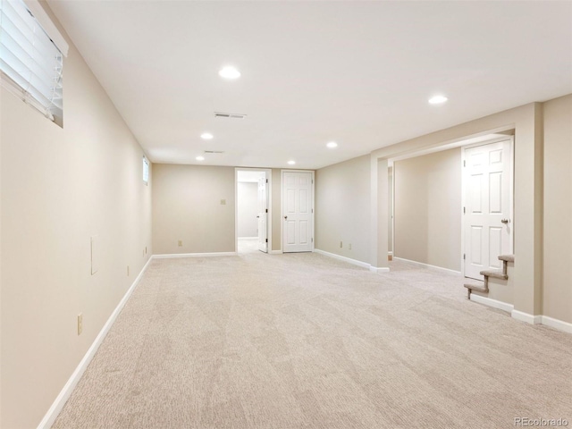 basement with light colored carpet