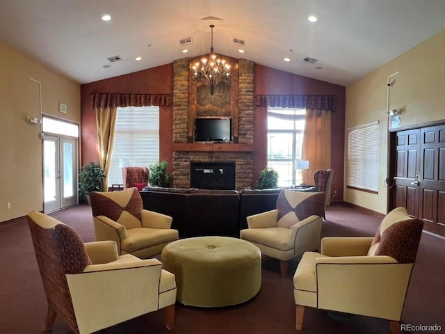 carpeted living room featuring a notable chandelier, visible vents, and a fireplace