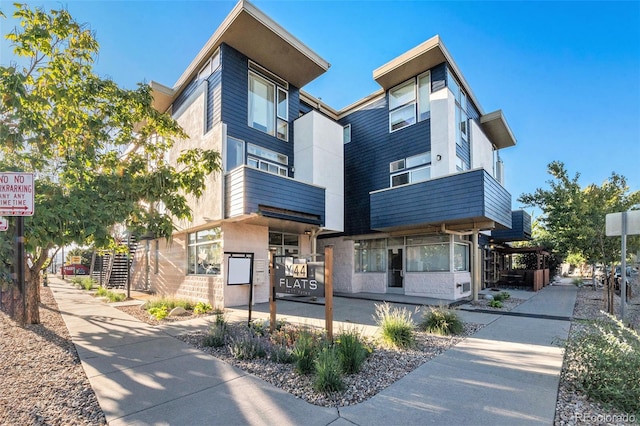 view of front of property with a balcony