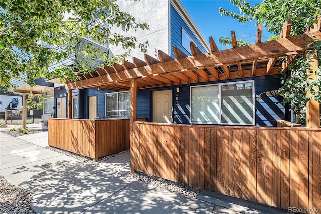 view of side of home with a pergola and a patio