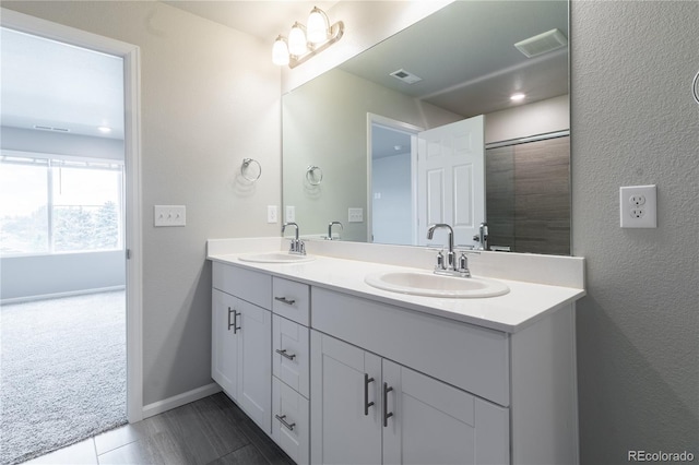 12213 Race St, Northglenn, CO 80241 - full bathroom featuring double vanity and baseboards