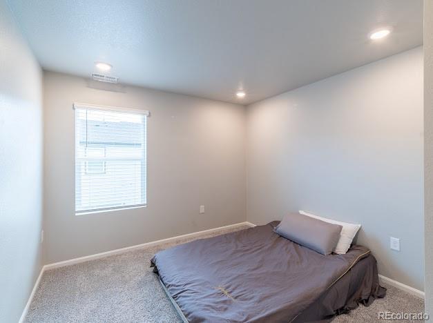 12213 Race St, Northglenn, CO 80241 - carpeted bedroom with baseboards and recessed lighting