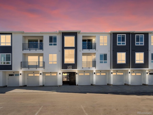 view of outdoor building at dusk