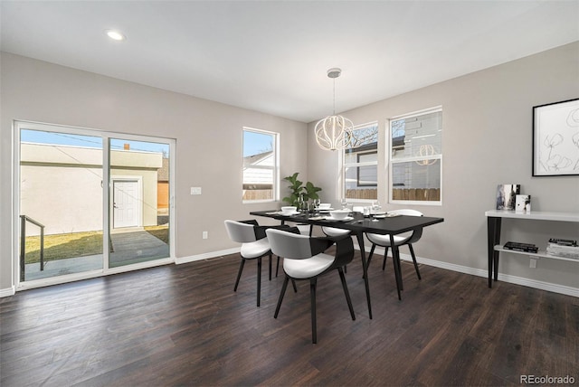 dining area with recessed lighting, baseboards, dark wood-style flooring, and a chandelier