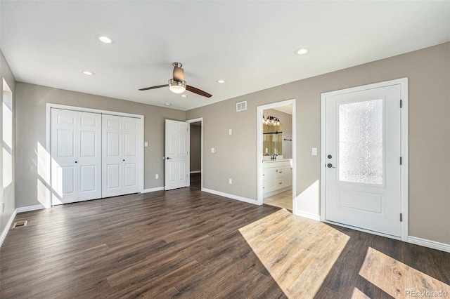 entryway with recessed lighting, visible vents, baseboards, and dark wood-style floors