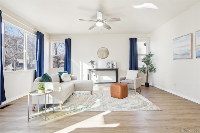 4844 Mt Evans St, Brighton, CO 80601 - living room with wood finished floors, ceiling fan, and baseboards