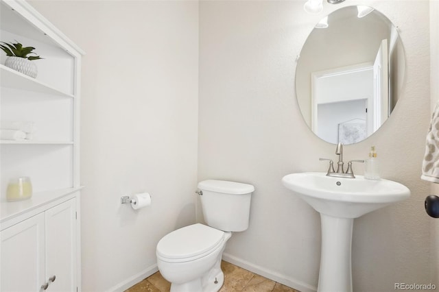 4844 Mt Evans St, Brighton, CO 80601 - bathroom with toilet, baseboards, and tile patterned flooring