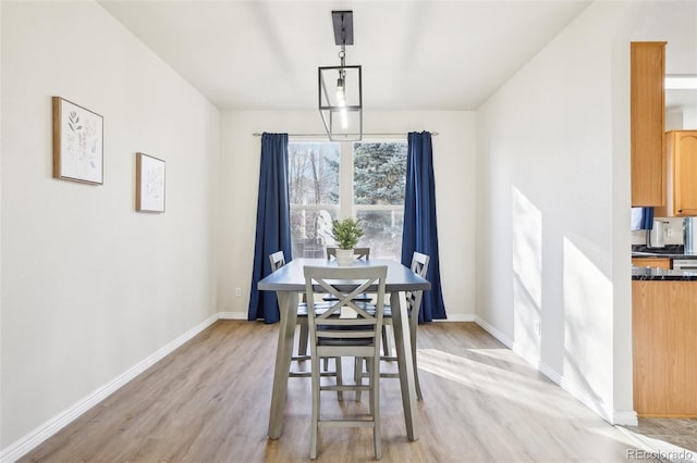 4844 Mt Evans St, Brighton, CO 80601 - dining space featuring light wood-style flooring and baseboards
