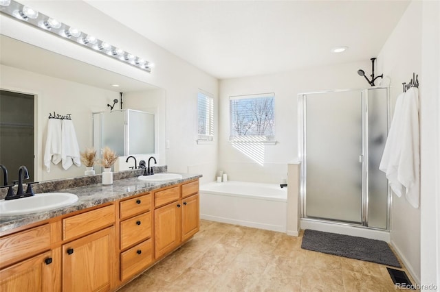 4844 Mt Evans St, Brighton, CO 80601 - full bath featuring a stall shower, a bath, and double vanity