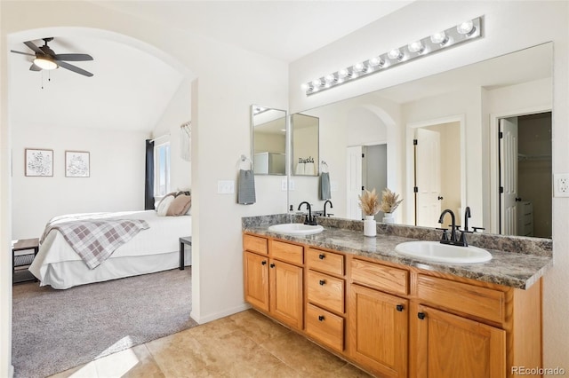 4844 Mt Evans St, Brighton, CO 80601 - bathroom featuring double vanity, a ceiling fan, ensuite bathroom, and tile patterned flooring