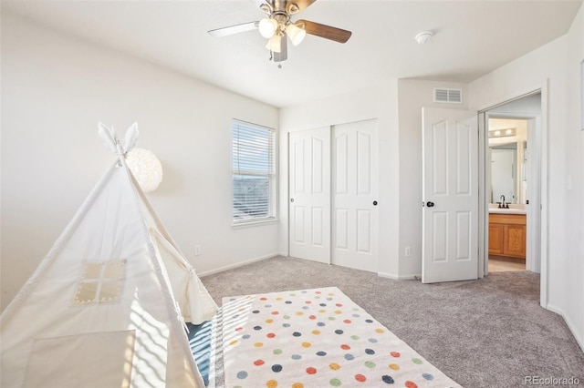4844 Mt Evans St, Brighton, CO 80601 - bedroom with light colored carpet, a closet, and a ceiling fan