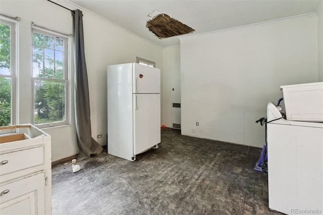 1900 S University Blvd, Denver, CO 80210 - kitchen with freestanding refrigerator, crown molding, and washer / dryer