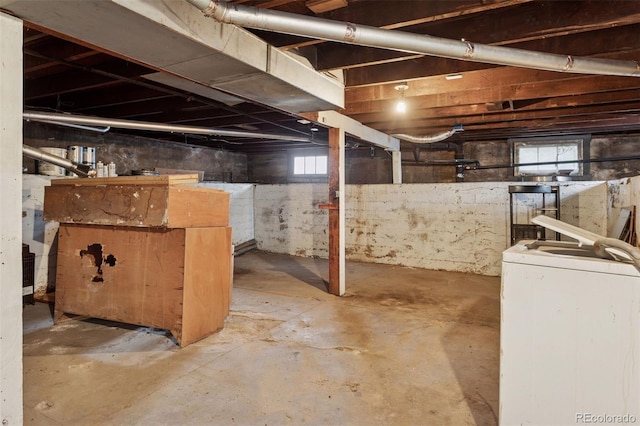 1900 S University Blvd, Denver, CO 80210 - basement featuring washer / dryer and healthy amount of natural light