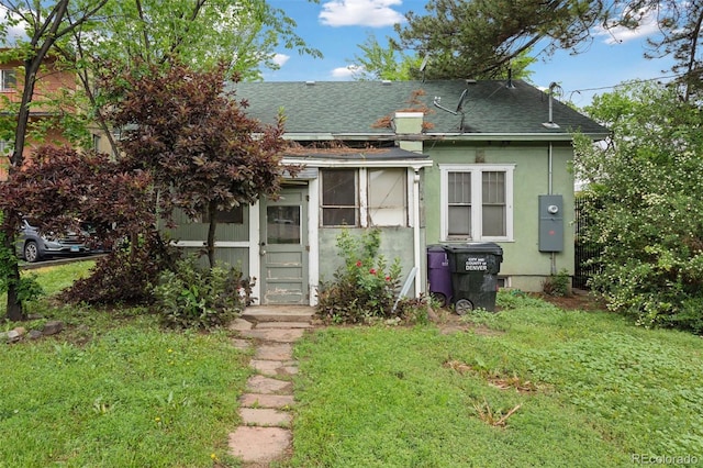 1900 S University Blvd, Denver, CO 80210 - view of front of property featuring a shingled roof, a front lawn, and stucco siding