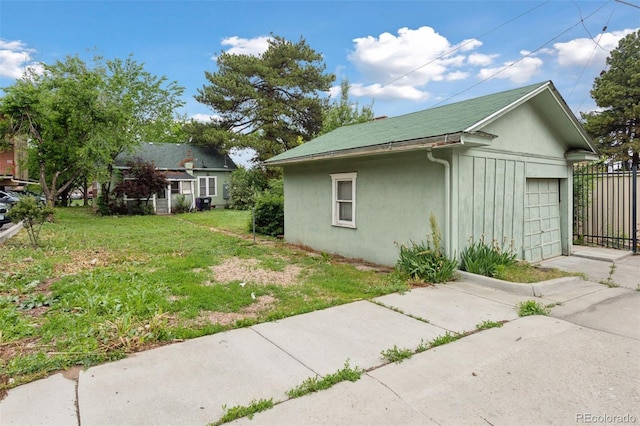 1900 S University Blvd, Denver, CO 80210 - view of side of property featuring stucco siding and a detached garage