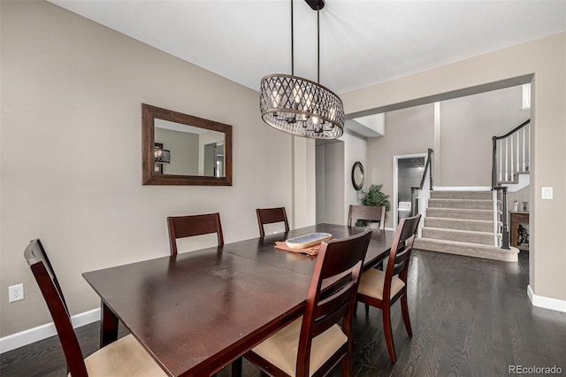 dining room with an inviting chandelier, baseboards, stairway, and dark wood finished floors