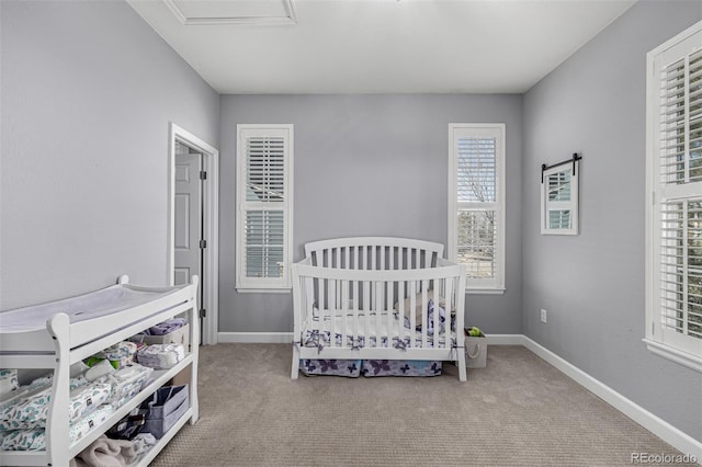 bedroom featuring carpet and baseboards