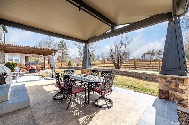 view of patio / terrace with outdoor dining area, fence, and area for grilling