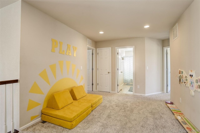 sitting room featuring carpet floors, recessed lighting, visible vents, and baseboards