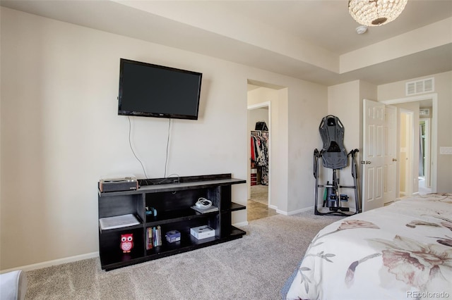 bedroom featuring carpet floors, visible vents, baseboards, a spacious closet, and a closet