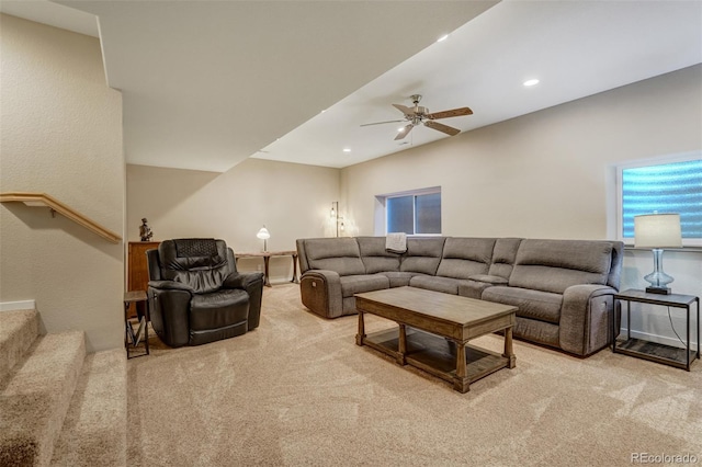 living room with ceiling fan and light colored carpet