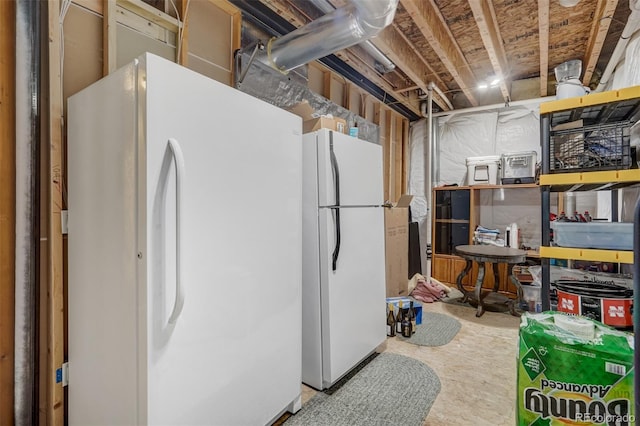 basement featuring white refrigerator