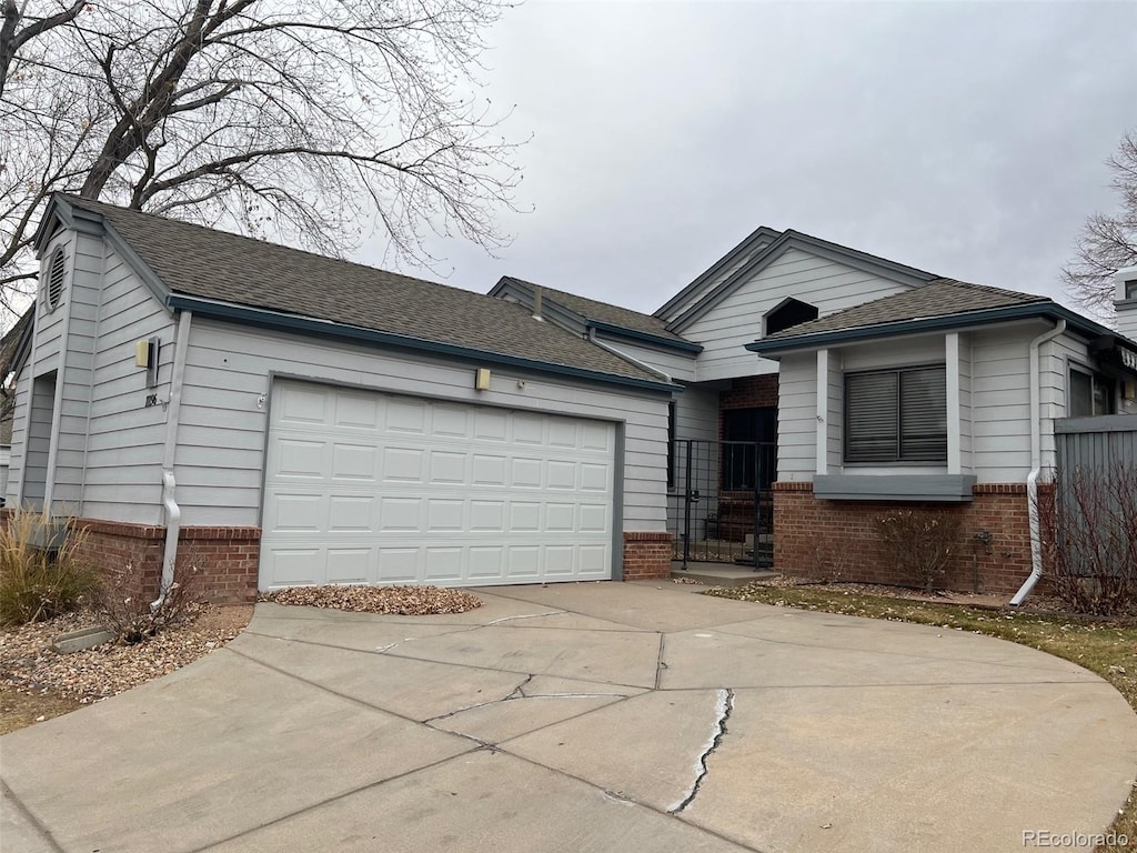 single story home with a garage