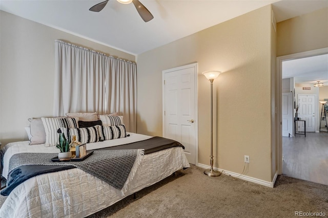 carpeted bedroom with ceiling fan