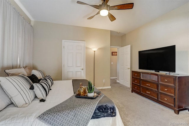 bedroom featuring ceiling fan and light colored carpet