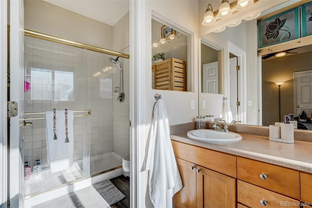 bathroom with vanity, toilet, and walk in shower