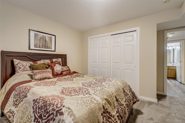 carpeted bedroom featuring a closet