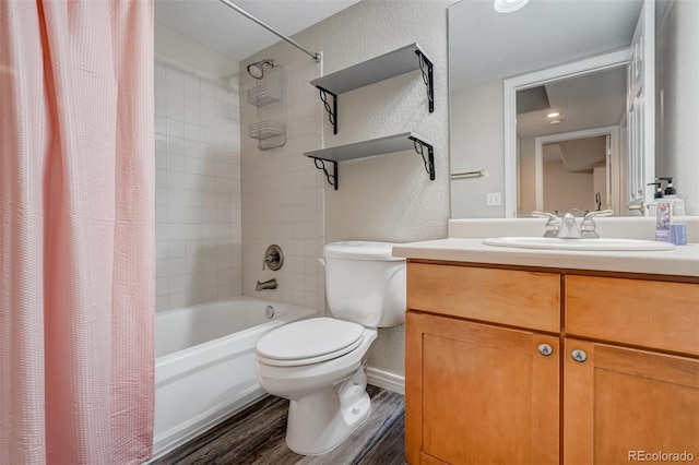 full bathroom featuring hardwood / wood-style flooring, toilet, vanity, and shower / bath combination with curtain