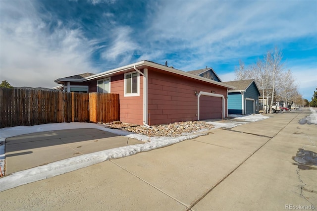 view of side of property with a garage