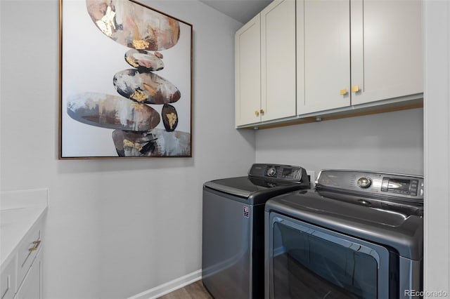 624 Simmental Loop, Castle Rock, CO 80104 - washroom featuring cabinet space and washing machine and clothes dryer