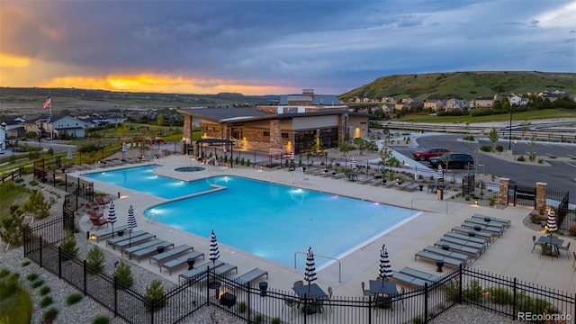 624 Simmental Loop, Castle Rock, CO 80104 - community pool with a hot tub, a patio area, and a mountain view