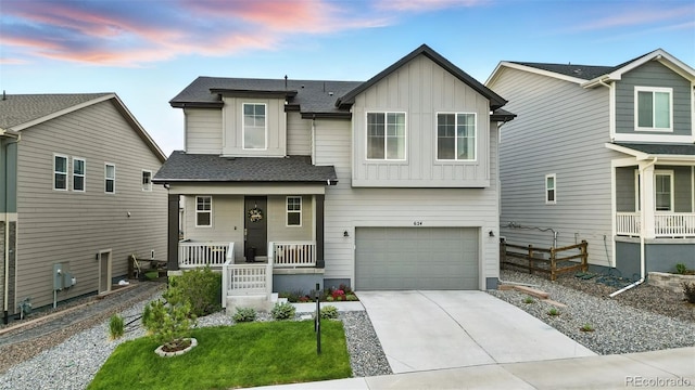 624 Simmental Loop, Castle Rock, CO 80104 - view of front facade with board and batten siding, covered porch, concrete driveway, a garage, and a shingled roof