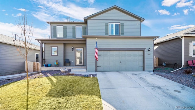 traditional-style home featuring driveway, an attached garage, and a front lawn