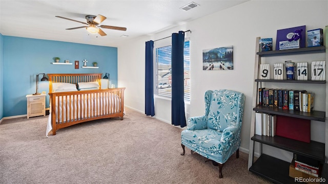 carpeted bedroom with a ceiling fan, baseboards, and visible vents