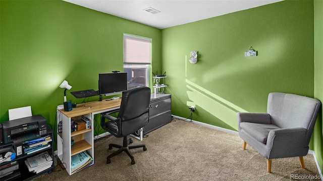 office with visible vents, baseboards, and carpet