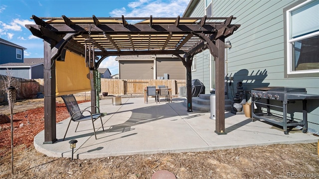 view of patio / terrace with a grill, a pergola, and fence