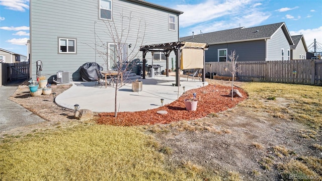 back of property featuring central air condition unit, a lawn, a pergola, a patio, and a fenced backyard