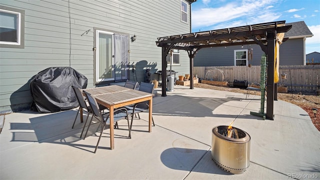 view of patio / terrace featuring a pergola, an outdoor fire pit, fence, a grill, and outdoor dining area