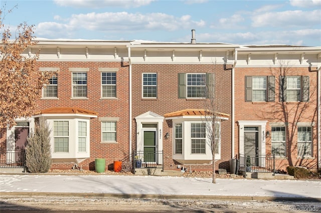 townhome / multi-family property with brick siding