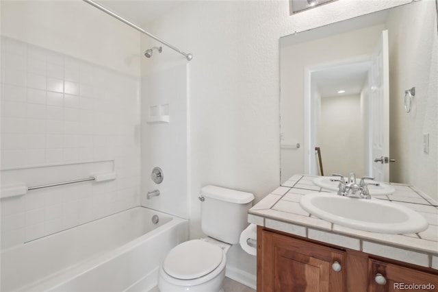 full bathroom featuring toilet, washtub / shower combination, and vanity