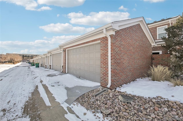 view of snow covered garage