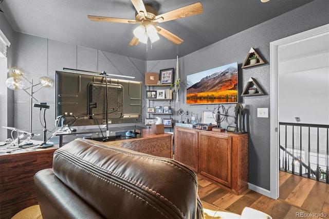 bar featuring ceiling fan and wood finished floors